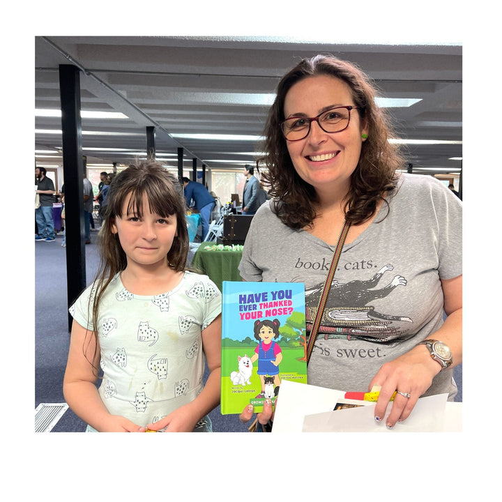 woman and her daughter holding Have You Ever Thanked Your Nose book