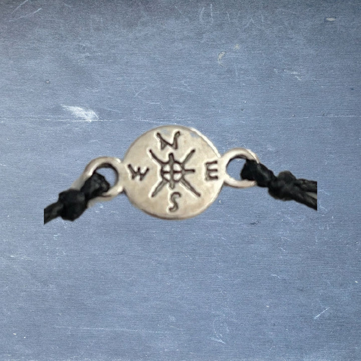 close up of the compass part of the bracelet
